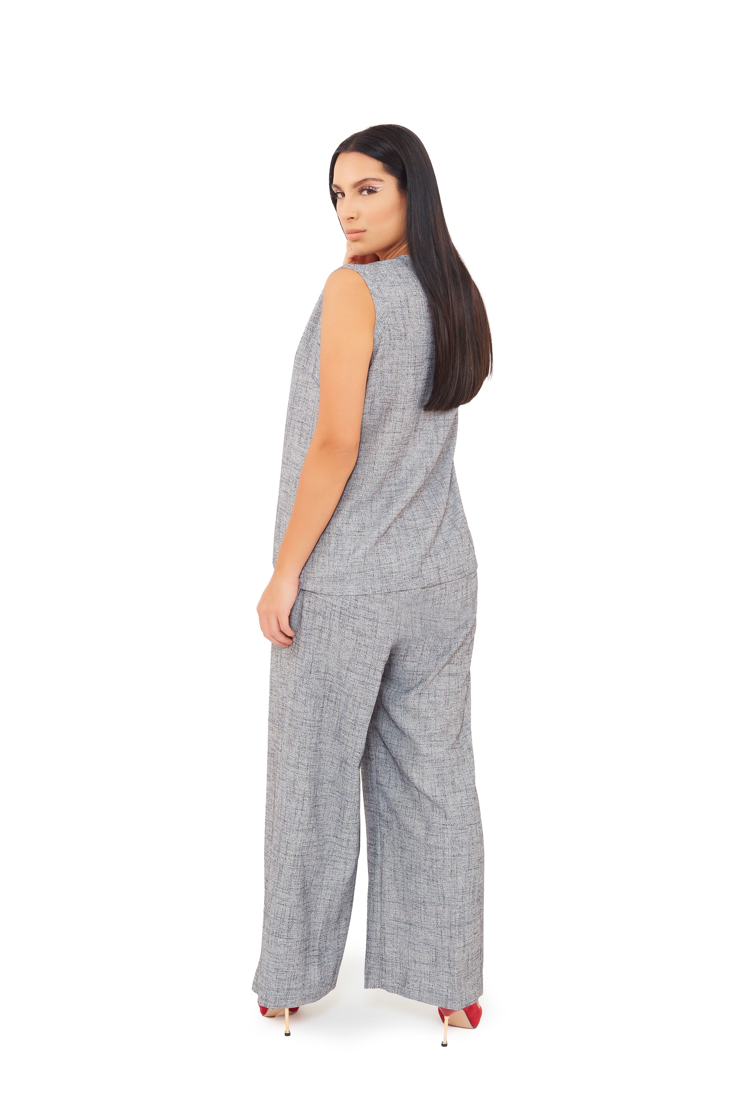 back look of loose sleeveless top with wide leg linen trouser 
