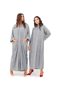 Grey jalabiya dress featuring a round neckline with loose long sleeves and a loose silhouette. 